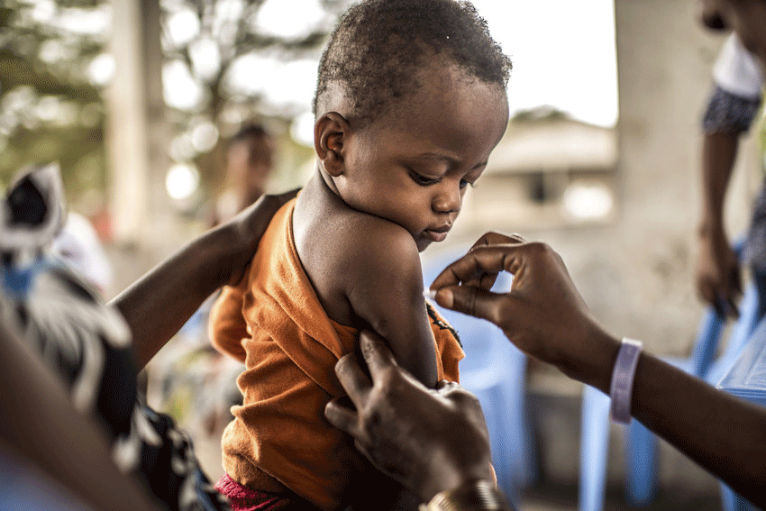 Young child receiving Yellow Fever vaccination.